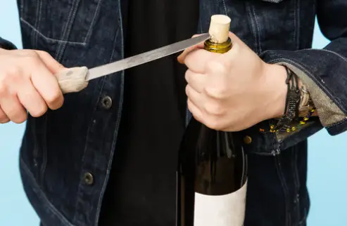 Use knife to open a Wine Bottle without a Corkscrew