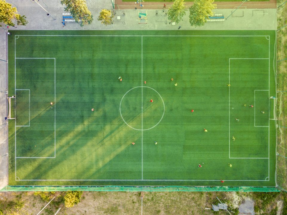 VOLGOGRAD,RUSSIA JUNE 1 2018: aerial top down view of two national footbal teams warm up before world campionship